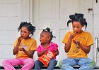 GirlsSharePotatoChips--3 copy  Makahlia Armstrong, 2, center, shares her potato chips with her friends Jasmine Hardy, 8, left, and Latasha Hardy, 9, right, on the front steps of the Hardy home in Spartanburg, Monday evening, 4-3-06. The three girls were relaxing from playing in the yard Monday, during Spring Break.  (NOTE: Stand-alone FEATURE)